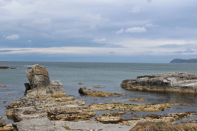 Small Group Giant's Causeway Day Tour from Belfast - Dunluce Castle gives the day a dramatic pause